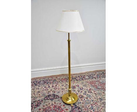 An early 20th century telescopic brass standard lamp on circular plinth base, height 126cm.
