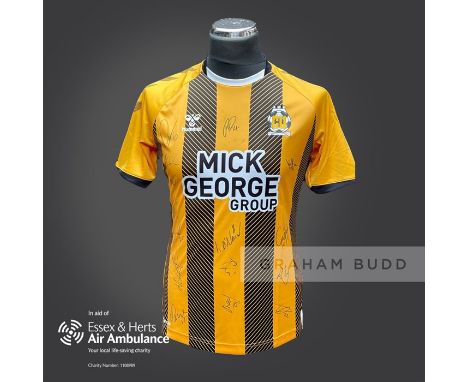 Cambridge United 2020-21 season replica shirt personally signed in black marker to the front by 15 members of the playing squ