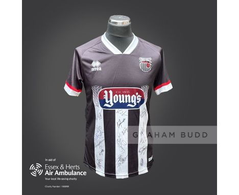 Grimsby Town 2020-21 season replica shirt personally signed in black marker to the front by 17 members of the playing squad. 