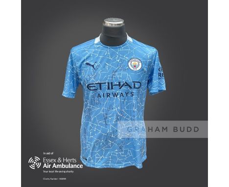 Manchester City 2020-21 season replica shirt personally signed in black marker to the front by 11 members of the playing squa