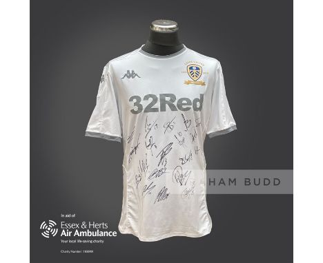 Leeds United 2019-20 season replica shirt personally signed in black marker to the front by 19 members of the playing squad. 
