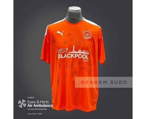 Blackpool 2020-21 season replica shirt personally signed in black marker to the front by 15 members of the playing squad. Com