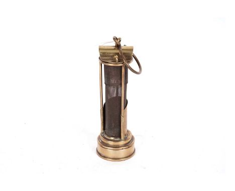 A 19th Century brass Davy miners lamp, with hinged lid, and three bars, maker unknown, 23cms high.