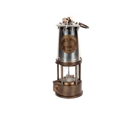 A brass and white metal miners safety lamp, by Eccles The Protector Lamp &amp; Lighting Co. Ltd., ‘Type 6 M &amp; Q Safety La