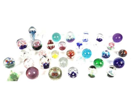 A selection of glass paperweights, of various designs, makers including Caithness and Langham, most unmarked.
