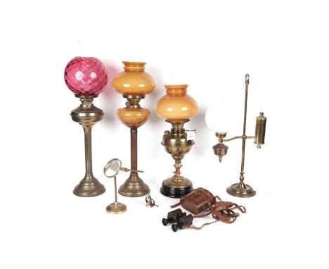 A collection of 19th Century brass oil lamps, comprising: a brass oil lamp, with mustard yellow moulded glass reserve and sha