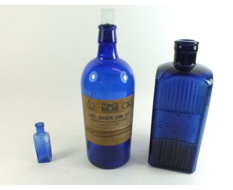 An Admiralty blue glass 24oz poison or medicine bottle with arrow mark, plus two other&nbsp; Bristol Blue bottles, one labell