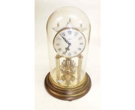 A Koma vintage tortion clock under dome