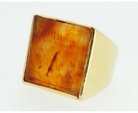 A large Islamic 18ct gold gentleman's ring set square agate with inscription, marked 750 - 2.2cm across and size R 1/2