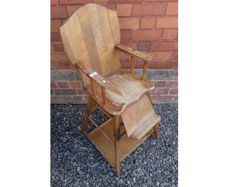 A vintage high chair converting to table and chair