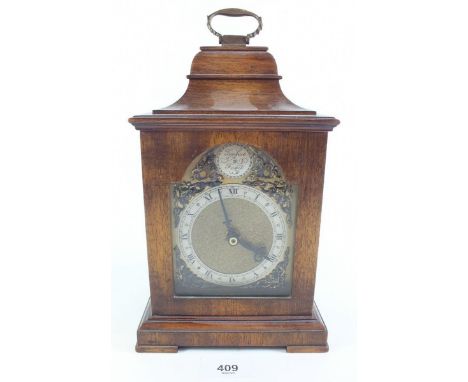 An antique style mahogany mantel clock with battery movement - 26cm 