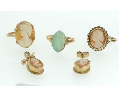 A 9ct gold green stone ring, two 9ct gold cameo rings and a pair of cameo 9 ct gold earrings 