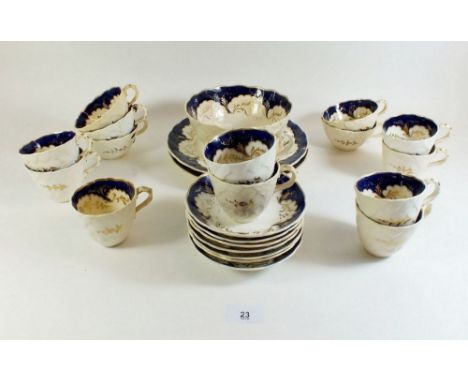 A Victorian tea service with blue and gilt decoration and moulded basketware exterior borders comprising:- seven coffee cups,