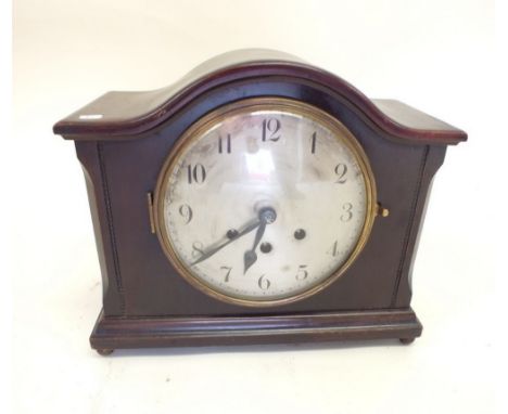 A 1920's mahogany cased arch top mantel clock with Westminster chime