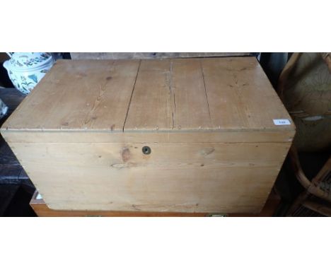 A Victorian pine trunk with hinged lid