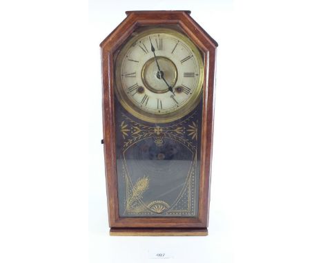 An American shelf clock with gilt decoration to glazed door