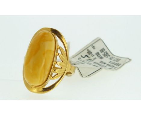 A Russian gold plated ring set amber, size 0 1/2