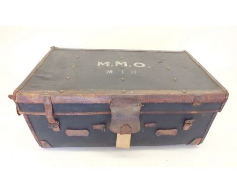 An antique large leather trimmed trunk