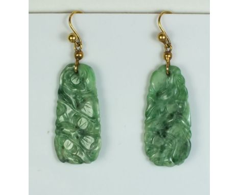 A pair of green carved jade pendant earrings, 3.3cm drop