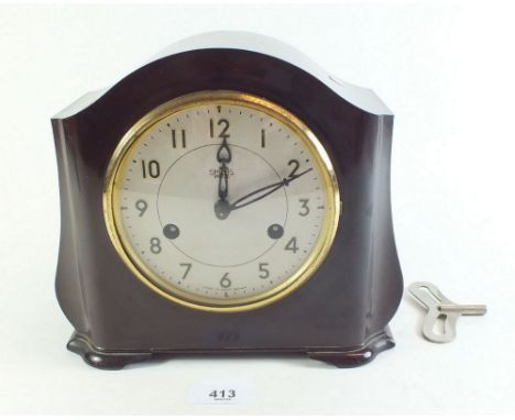 A Smiths Bakelite cased 1930's mantel clock, with key and striking movment, recently serviced 