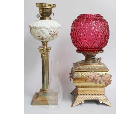 A Welsh Room Heater/Oil Lamp in the Japanese Style, of square form, with moulded cranberry glass shade; a brass Corinthian co