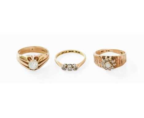 A Diamond Three Stone Ring, stamped '18CT' and 'PLAT', finger size L1/2; together with Two 9 Carat Gold Rings, including an o