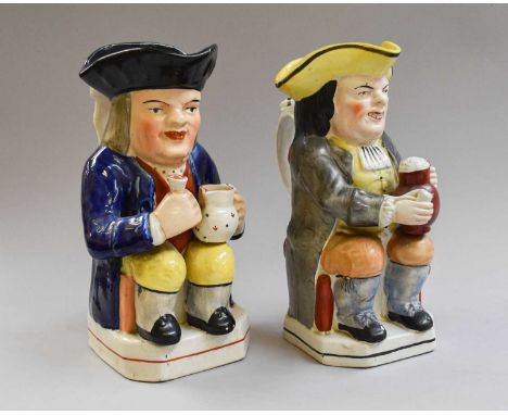 A 19th Century Toby Jug of Woodtype, painted in enamel, with mug of ale and pipe; together with another similar (2)