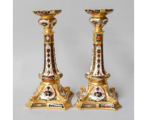 A Pair of Royal Crown Derby Imari CandlesticksNo damage or repair. Some notable gilt wear. Both first quality and with origin