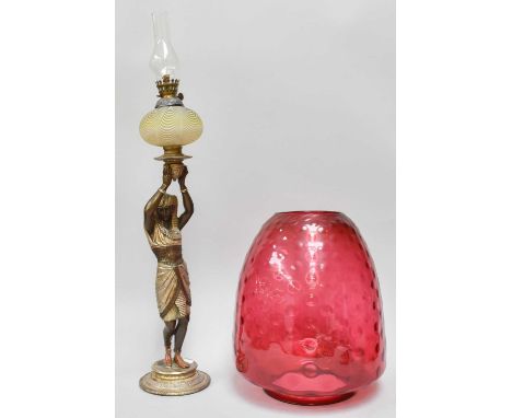 An Egyptian Style Figural Oil Lamp, in bronzed spelter, with yellow striated glass reservoir, and glass chimney; a large cran