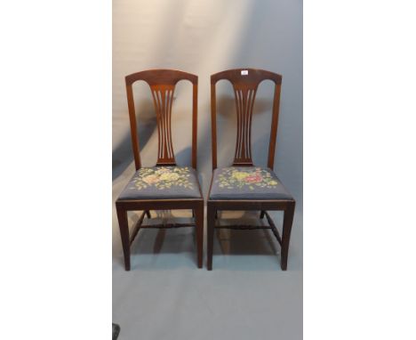 A pair of mahogany splat back art deco chairs with tapestry seats.