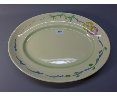 A Clarice Cliff meat plate having decorated border with flowers 