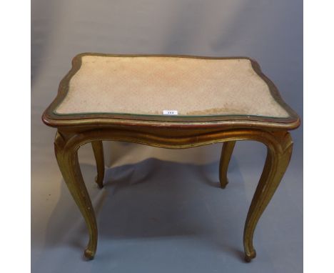 An early 20th Century French giltwood side table, The cartouche share top inset with glass and raised on cabriole legs. H-68c