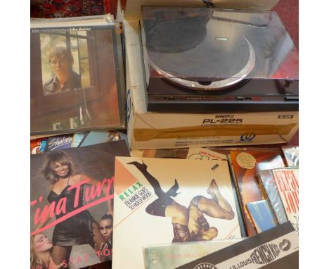 A Pioneer record player together with a selection of 70's vinyl records.