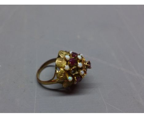 A yellow metal opal and garnet set princess ring.