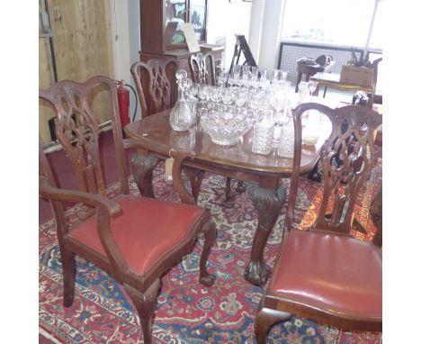 A set of six Chippendale style mahogany dining chairs with matching extending dining table.