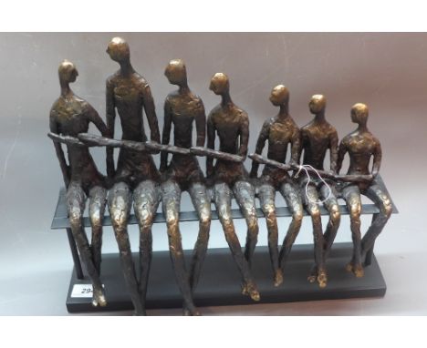 In the manner of Giacometti a resin sculpture of figures on a bench. 