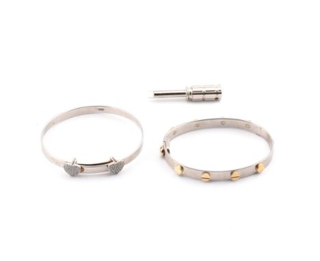 Two silver and gem set baby bangles. The two children's bangles to include a silver designer style screw detail hinged bangle