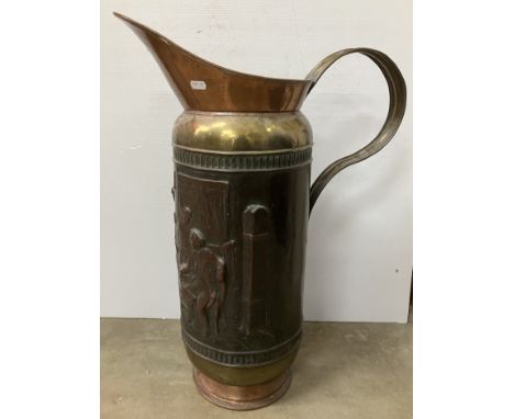 An embossed copper and brass over-sized jug or stick stand 68.5 cm