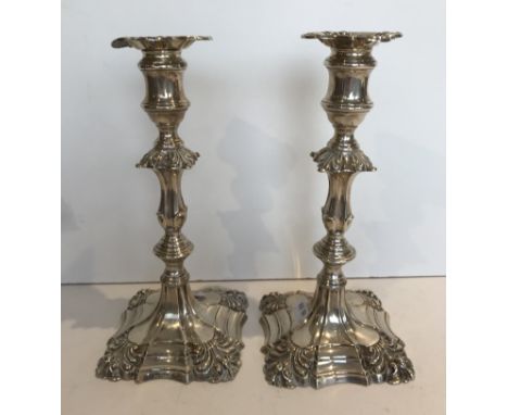 A pair of Edwardian silver table candlesticks in the early 18th Century manner (by Thomas Bradbury & Sons of Sheffield, 1900)