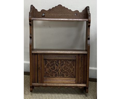 A Victorian mahogany dwarf cupboard with two arched panelled doors enclosing shelving, 68 cm wide x 31 cm deep x 89.5 cm high