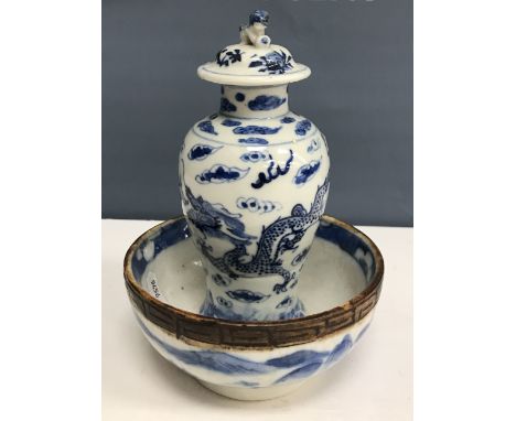 A Chinese blue and white baluster shaped vase and cover, the domed top with Dog of Fo finial over a four toed dragon decorate