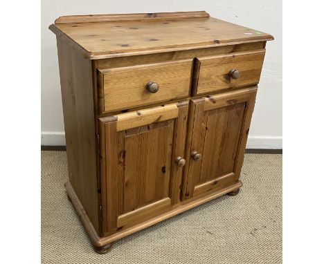 A mid 20th Century oak bureau, the sloping fall with three panels enclosing a basic fitted interior over three drawers, 76 cm