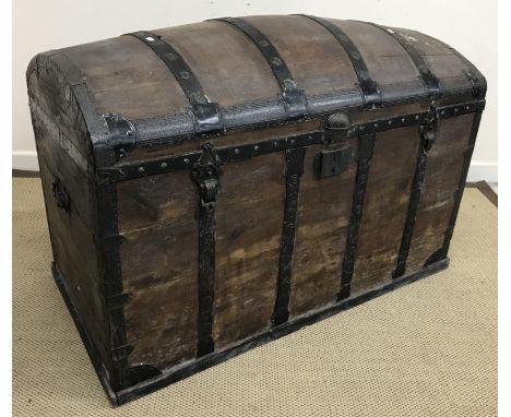 An iron bound dome top trunk, 111 cm wide x 59 cm deep x approx 76 cm high