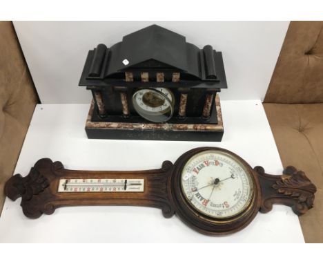 A slate and marble mantel clock of architechtural form, the enamel and brass dial set with Arabic numerals and inscribed "J.W