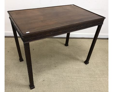 A mahogany silver table in the Chippendale taste, the plain top with beaded edge over blind fretwork frieze and square chamfe