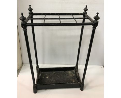 A circa 1900 black painted iron stick stand, the plain eight section top on column supports, 41 cm wide x 23 cm deep x 62 cm 