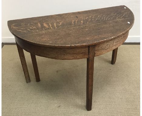 An 18th Century walnut tea table, the circular snap top on a turned pedestal to cabriole tripod base and pad feet 71 cm diame