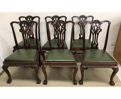 A set of eight early 20th Century mahogany Chippendale style dining chairs on cabriole legs to claw and ball feet, carvers 61