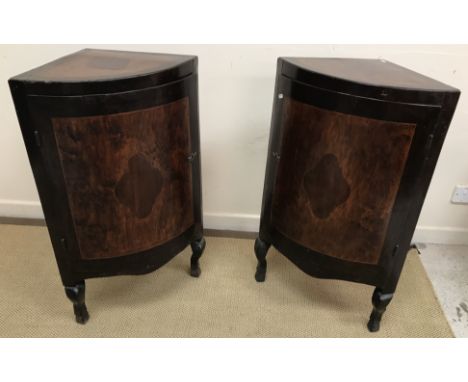 A pair of 19th Century Maltese walnut and inlaid bow fronted corner cupboards, the tops set with centre medallion and cross b