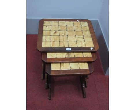Vintage nest of tables all with tiled tops.